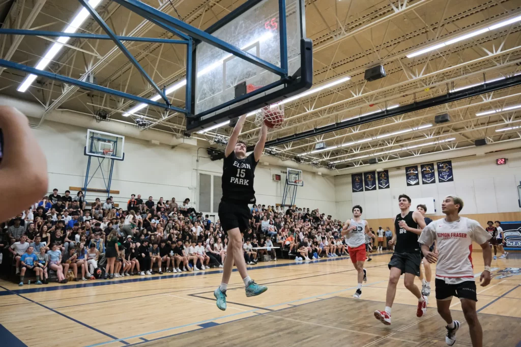 Adam Olsen dunks the ball in front of a sold out crowd.