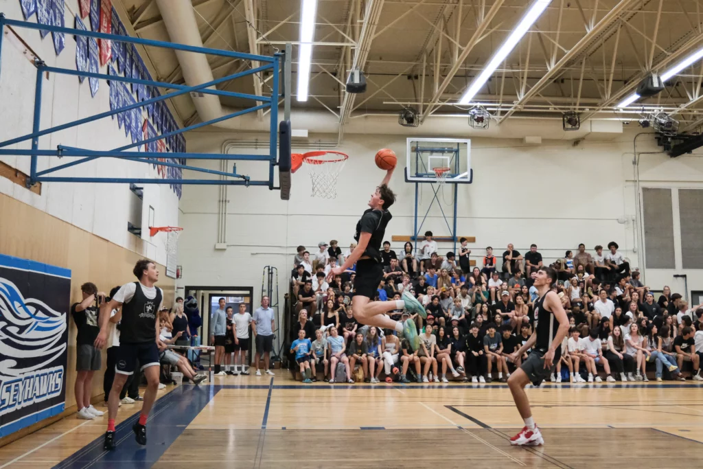 Adam Olsen rises for a dunk.