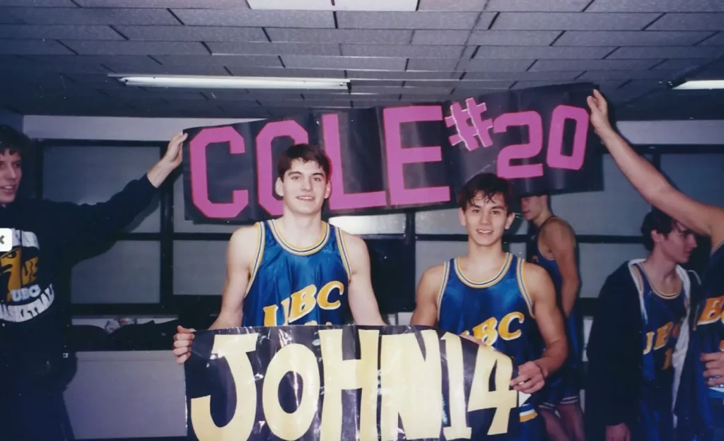 John Dumont holding a sign fans made, during his time playing for UBC