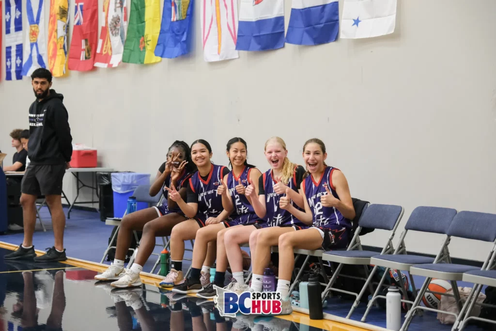 New West Elite's bench smiles and poses for the camera at the 2023 BBall Nationals.