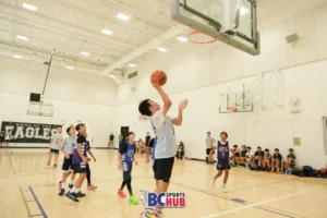 Henry Paik from JR Basketball jumps up for a wide-open shot in front of the rim.