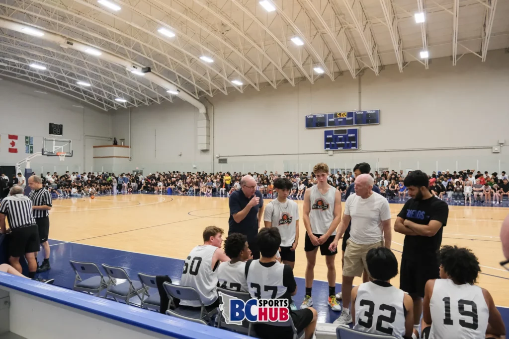 PGC Basketball Academy huddle for a time out in front of a full crowd at BBall Nationals 2023.