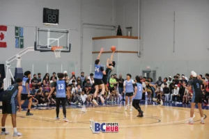Ajaypal Hayer attempts a mid-range floater against Deep Cove Elite's Declan Cutler rising up for a tough contest.